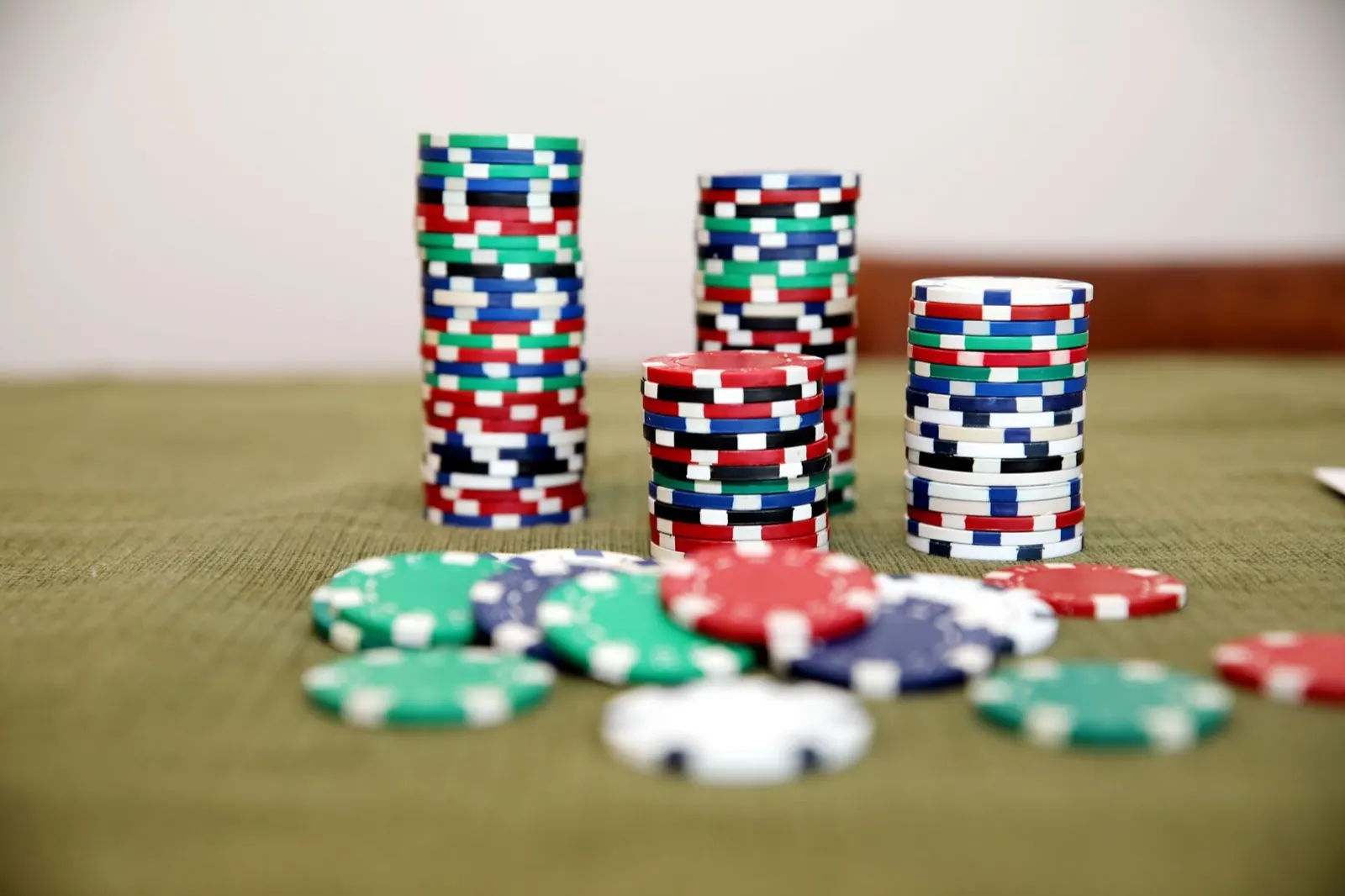 Close-up of casino poker chips stacked on a table
