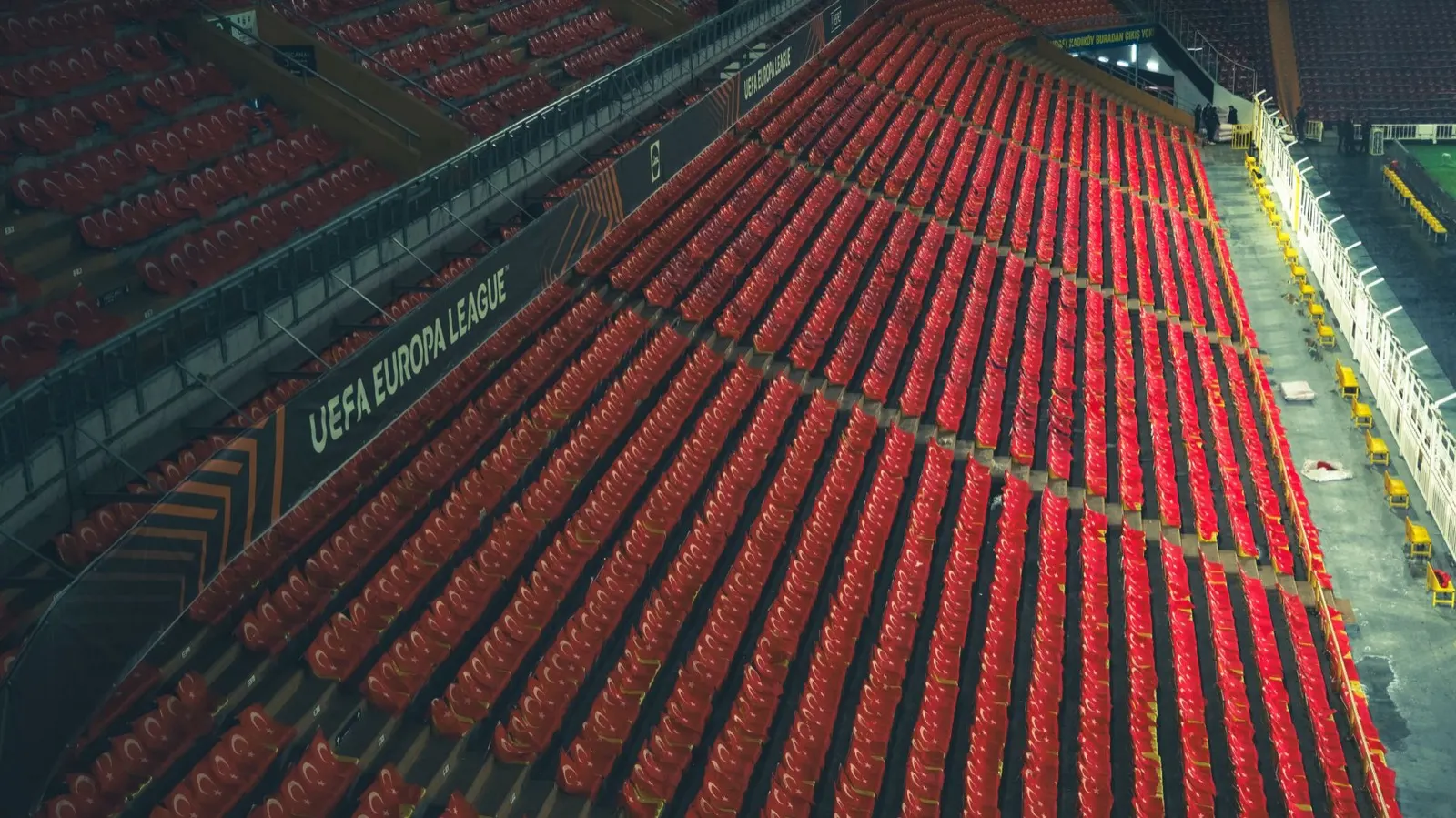 Empty generic sports-arena interior bowl, no team branding visible